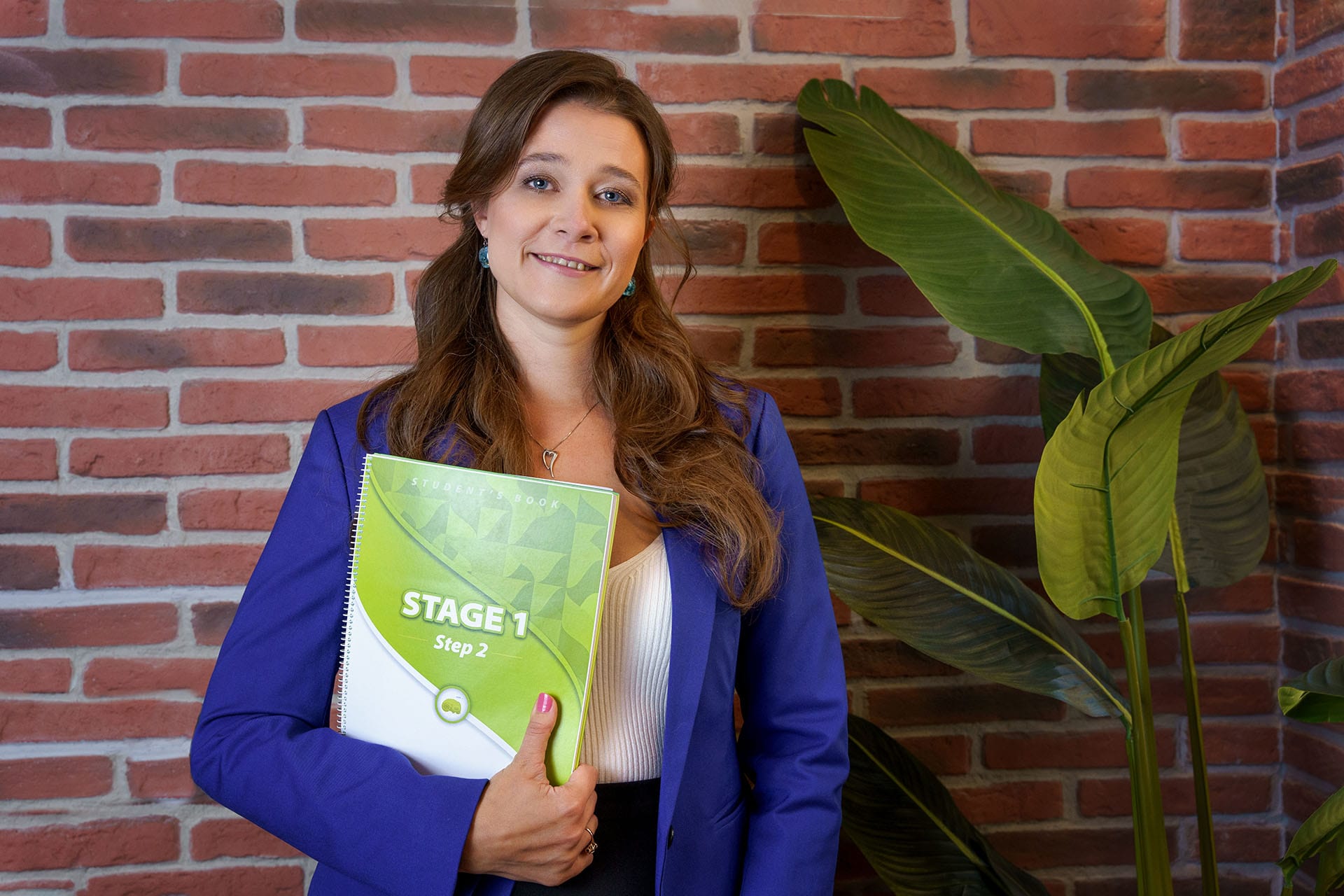 María Valdmane with her student’s book María Valdmane with her student's book